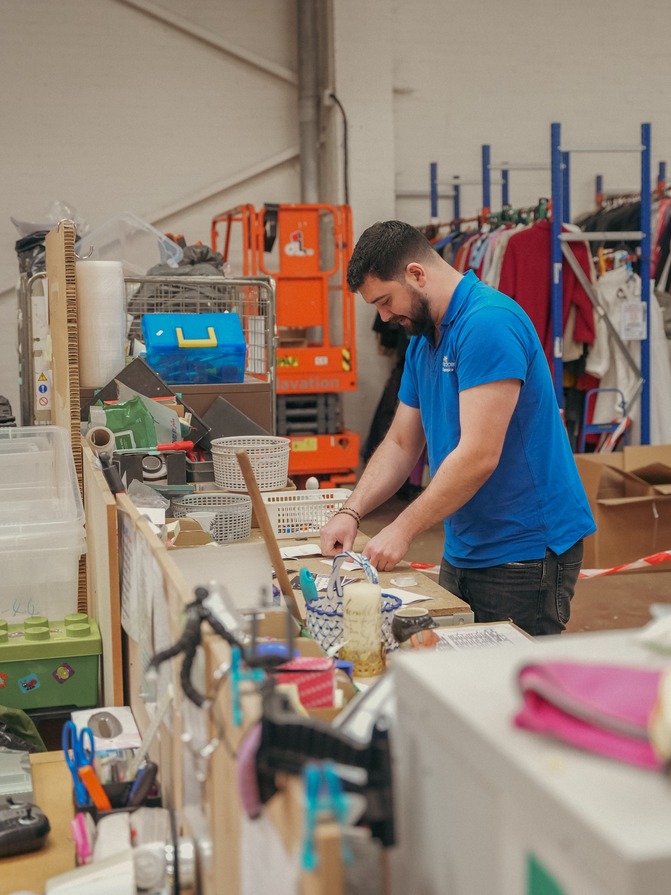 A retail volunteer at the current Cynthia Spencer shop and donation station